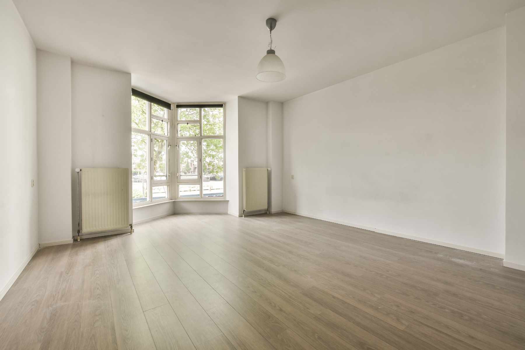 interior-of-empty-room-with-windows-PQBJSLJ.jpg